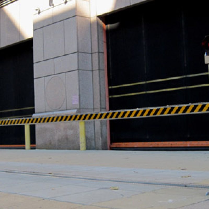 Global GRAB's Innovo Horizontal Beam Barrier installed in front of a building entrance